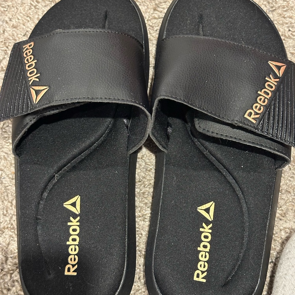 Reebok Black Slides with Metallic Gold Accent
